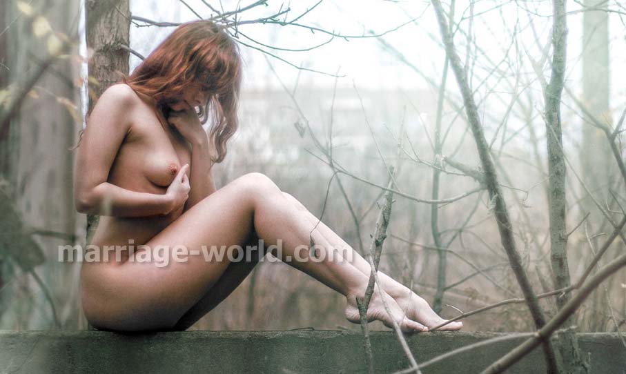 naked russian woman sitting in woods